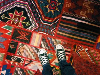 Low section of woman standing on tiled floor