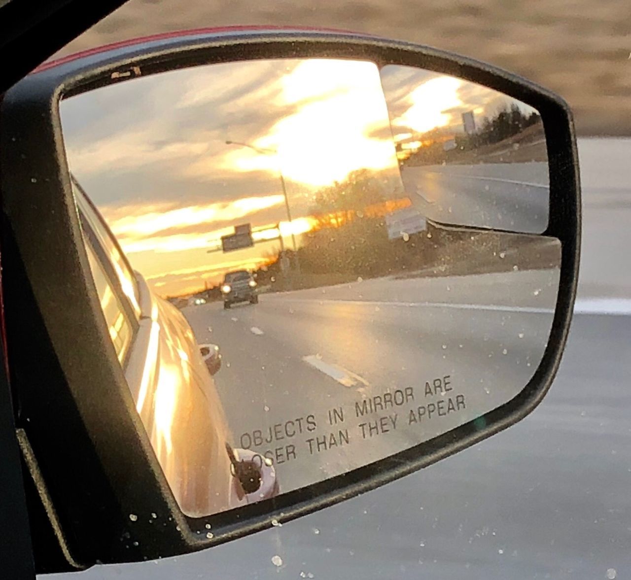 reflection, car, mode of transportation, transportation, motor vehicle, side-view mirror, rear-view mirror, glass, sunset, sky, light, mirror, automotive mirror, window, land vehicle, nature, close-up, travel, automotive exterior, cloud, no people, vehicle, vehicle mirror, outdoors, glasses, sunglasses, city
