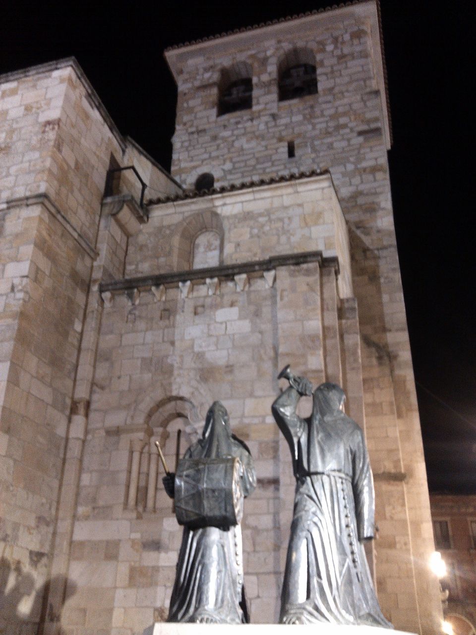 low angle view, architecture, built structure, building exterior, statue, religion, human representation, sculpture, spirituality, church, place of worship, history, art and craft, art, creativity, old, the past