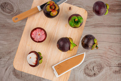 High angle view of fruits on cutting board