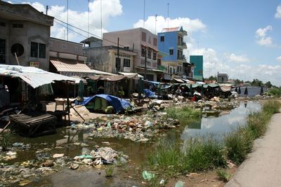 Buildings against cloudy sky