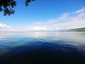 Scenic view of sea against blue sky
