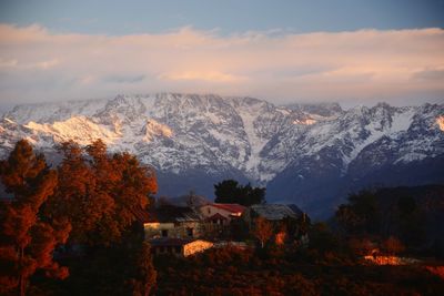 Scenic view of snowcapped mountains against sky during winter