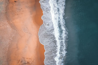 Close-up of icicles on sea shore