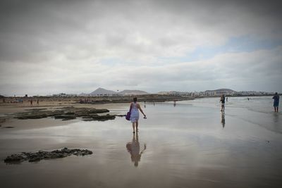 Reflection of people in water