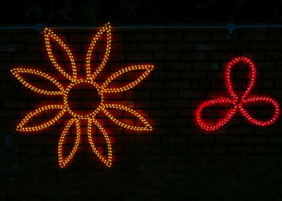 Close-up of illuminated decoration hanging at night