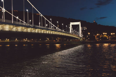 Illuminated elisabeth bridge over river at night