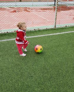 Girl playing with soccer ball 