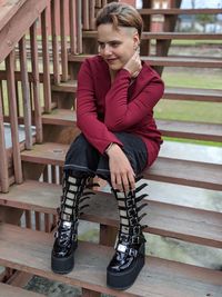 Young woman sitting on bench