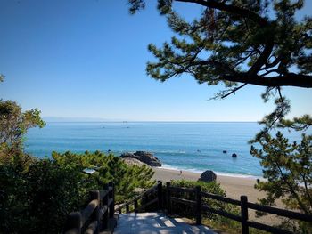 Scenic view of sea against clear blue sky