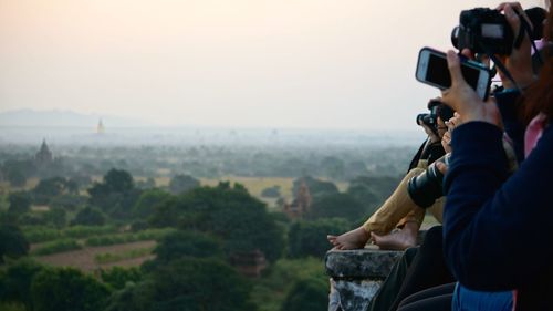 Photographer holding camera