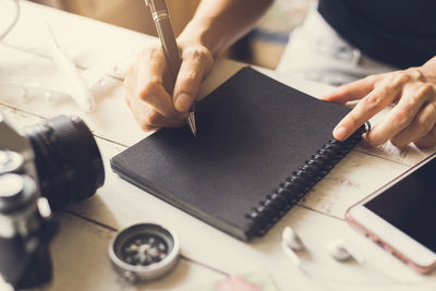Midsection of woman working on table