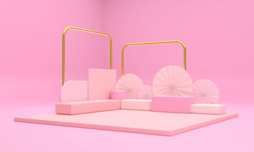Close-up of table against pink background