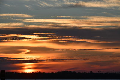 Scenic view of dramatic sky during sunset