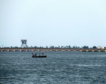 Scenic view of bridge over sea against clear sky