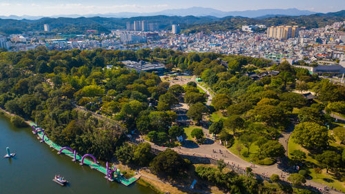 High angle view of river amidst buildings in city