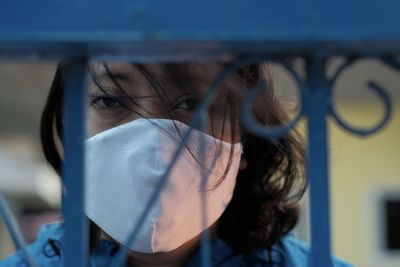 Girl wearing a mask at home during the quarantine from the corona virus outbreak