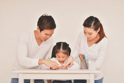 Cute girl studying at table