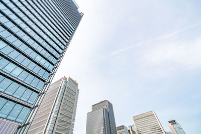 Low angle view of modern buildings against sky