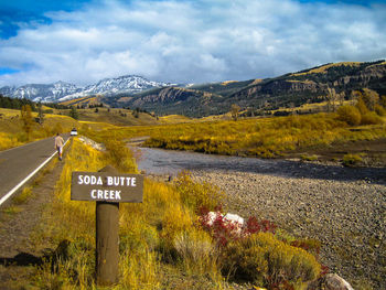 View of landscape with mountain range in background