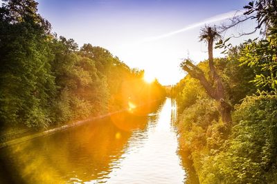 Scenic view of river at sunset