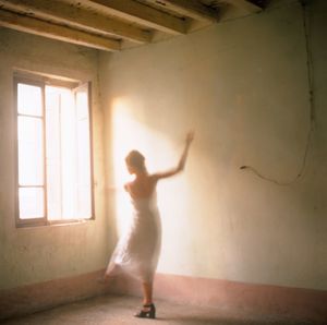 Woman performing in front of a room