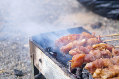 Close-up of meat on barbecue grill