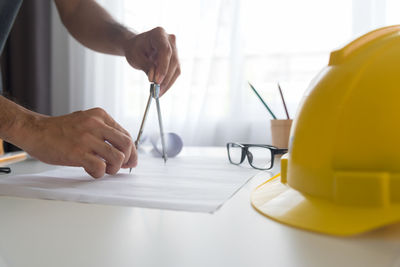 Close-up of man working on table