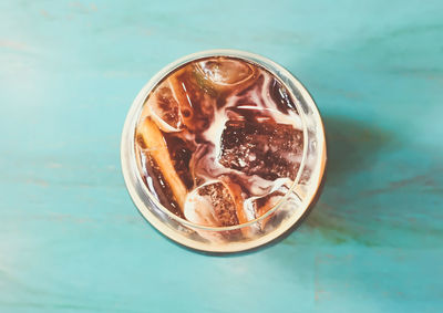 High angle view of coffee in glass on table