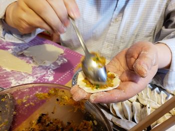 High angle view of man preparing food