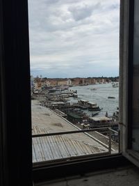 Buildings against cloudy sky