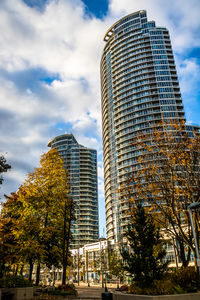 Low angle view of skyscrapers against sky