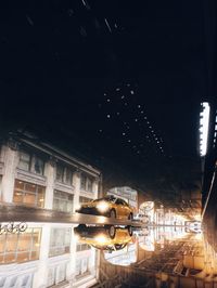 Low angle view of illuminated building at night