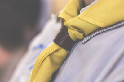 Midsection of boy wearing scout scarf