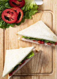 Directly above shot of sandwiches on cutting board