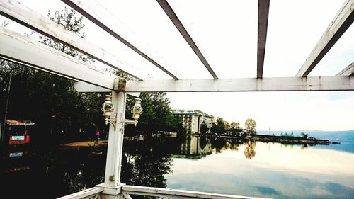 View of bridge over calm sea