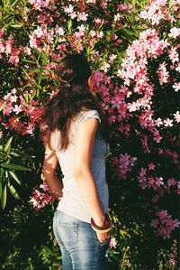 Woman standing by plants