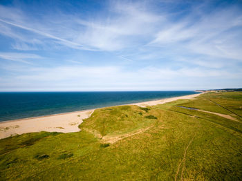 Scenic view of beach against clear sky