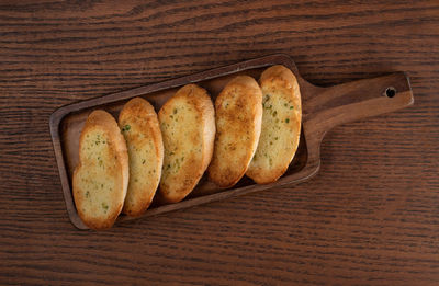 High angle view of bread on wooden table