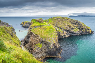 Panoramic view of rocks on beach against sky