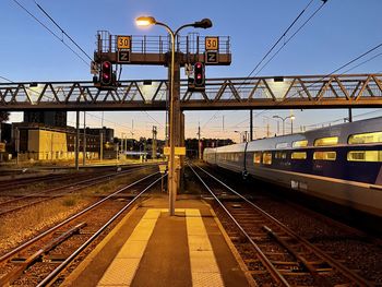 Train on railroad station platform against sky