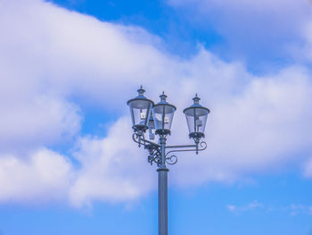 Low angle view of street light against sky