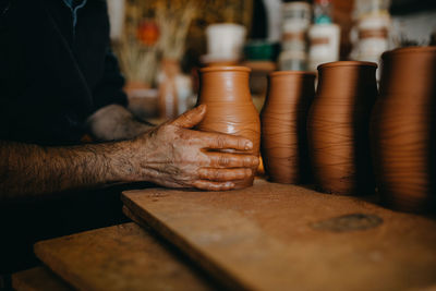 Man working with clay pottery