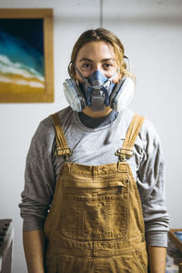 Portrait of female resin artist in homemade art studio