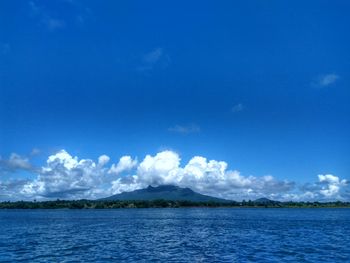 Scenic view of sea against blue sky