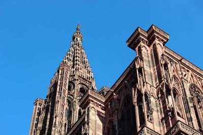 Low angle view of temple against clear blue sky