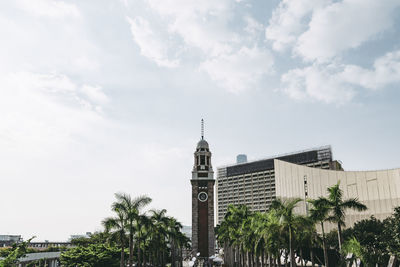 View of buildings against cloudy sky