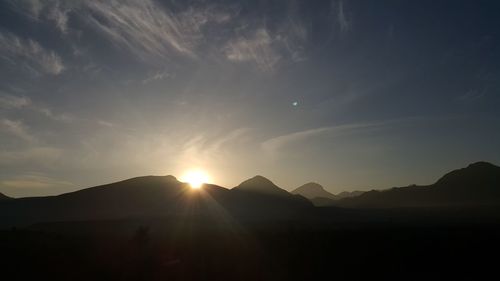 Scenic view of mountains against sky at night