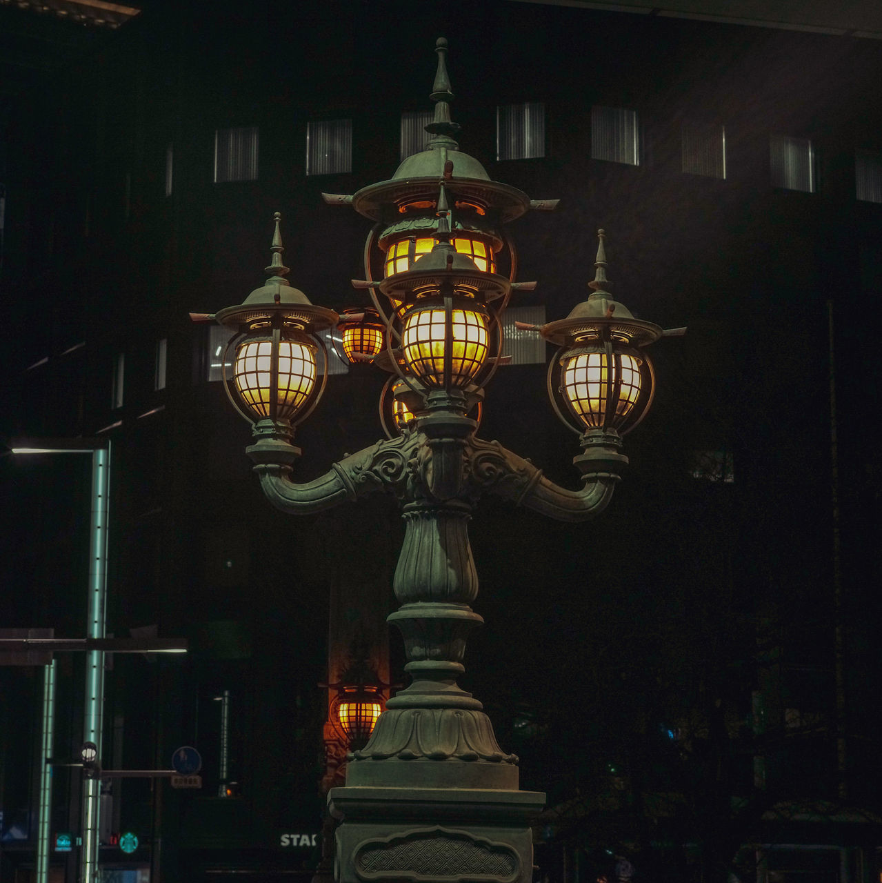 illuminated, lighting equipment, architecture, built structure, no people, night, building exterior, city, building, street light, street, outdoors, light, travel destinations, low angle view, electric lamp, history, glowing, art and craft, electric light