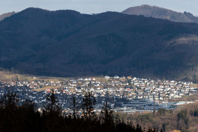 High angle view of townscape and mountains